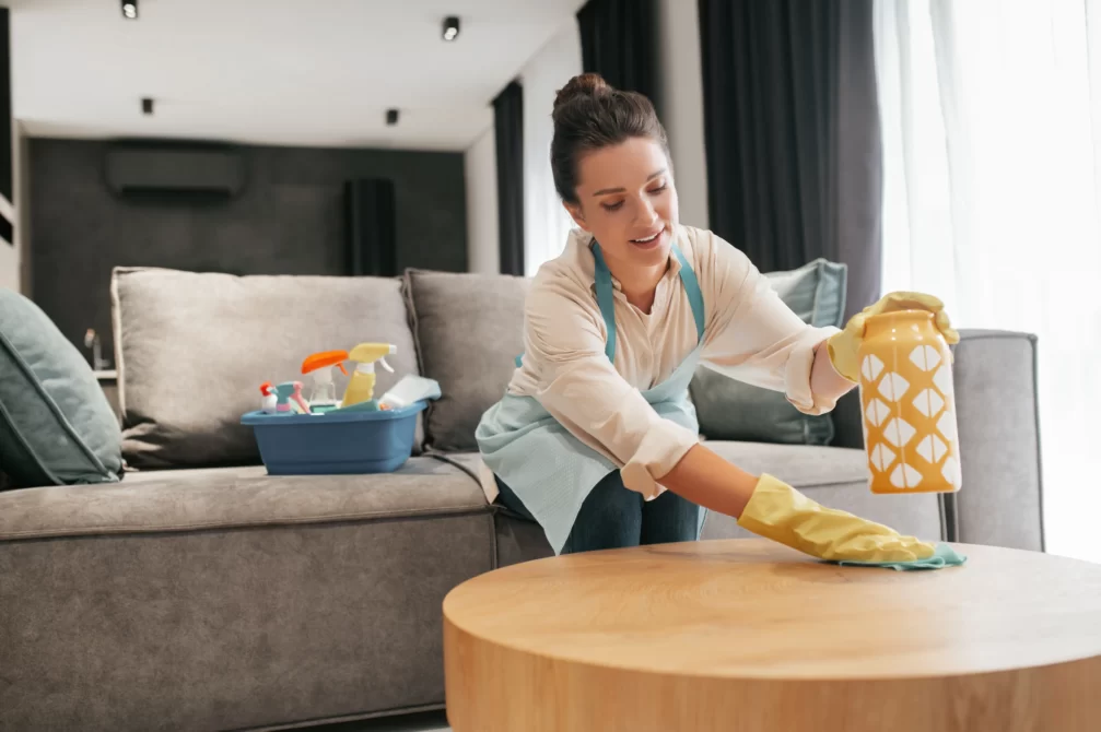 chores woman cleaning table surfcase with disinfector Value Maids - New South Wales | Become Your Own Boss