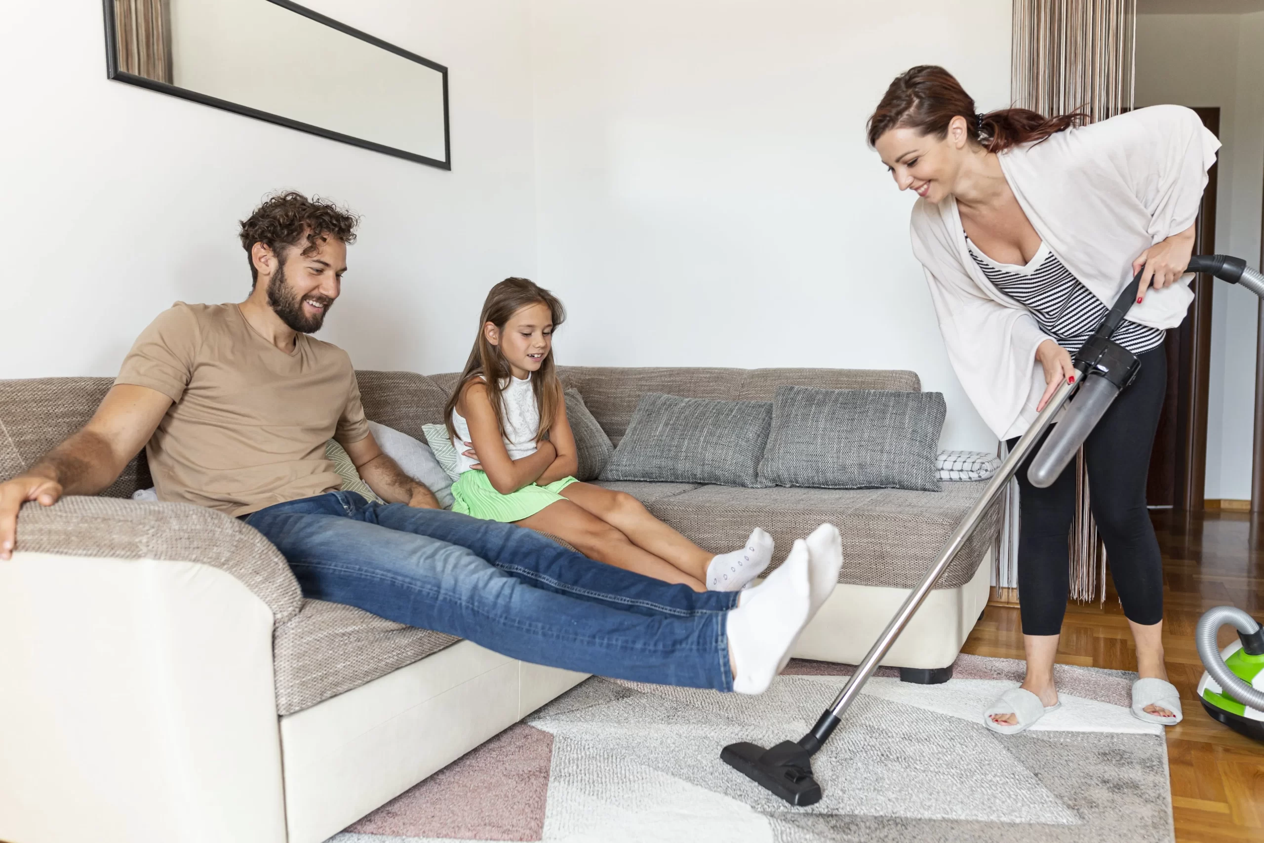 woman vacuuming carpet min scaled About Us