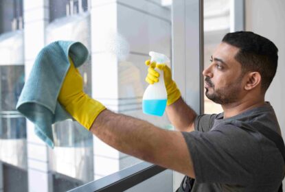 medium shot man cleaning office window compressed Services