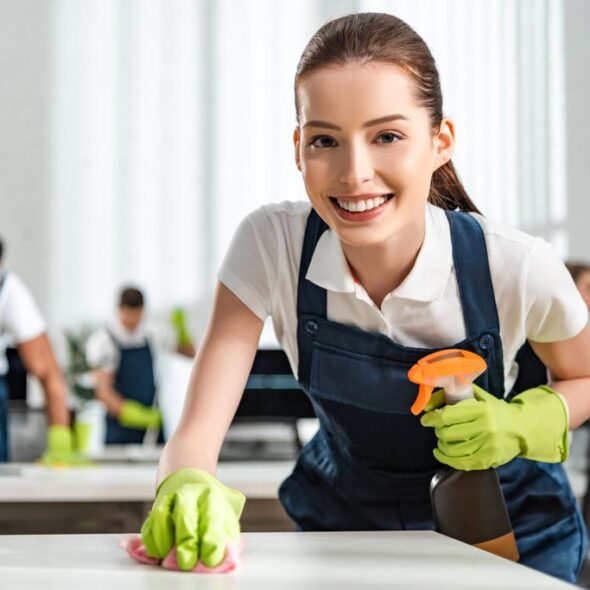 stock photo happy cleaner looking camera while 1 2 590x590 1 Value Maids - New South Wales | Become Your Own Boss